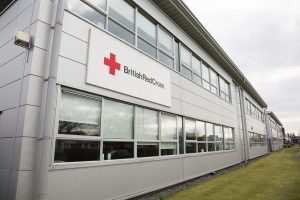 "Glasgow, UK - March 31, 2013: British Red Cross offices in Hillington, Glasgow. Part of the UK branch of the International Red Cross and Red Crescent Movement, an international humanitarian organisation."