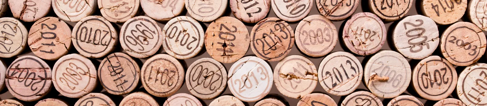 masthead stacking of wine cork background with vintage years v2